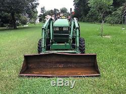 2000 John Deere model 4600 tractor with front loader and 6' Woods Brush cutter