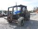 New Holland TS6030 Wood Boss 4x4 Utility Tractor