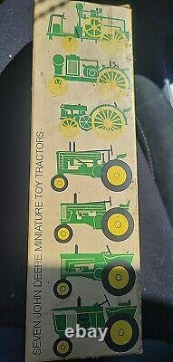 Seven John Deere Miniatures Toy Tractors